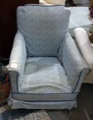 Early 20th century low salon chair in blue foliate loose covers