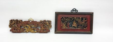 Late 19th/early 20th century Chinese carved and pierced panel in a red painted and gilt decorated