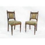 Set of four walnut-framed chairs with upholstered seats and backs, on turned front legs (4)