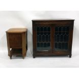 20th century oak bookcase with leaded glazed doors enclosing shelves, to square section supports and