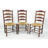 Set of four 20th century oak ladderback dining chairs with rush seats (4)