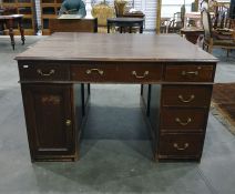 Early 20th century mahogany partner's desk with assorted drawers and cupboard doors, 125cm