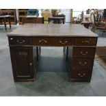 Early 20th century mahogany partner's desk with assorted drawers and cupboard doors, 125cm