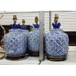 Five ceramic ovoid table lamps, blue criss-cross decoration (one damaged) (5) (VAT payable on