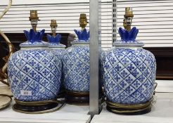 Five ceramic ovoid table lamps, blue criss-cross decoration (one damaged) (5) (VAT payable on