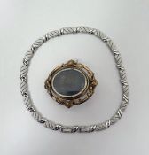 Victorian gilt metal portrait brooch pendant of oval form with central swivel double-sided glazed