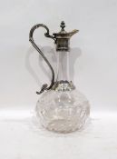 Clear glass and silver-coloured metal mounted claret jug with engraved mounts, shaped handle to