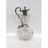 Clear glass and silver-coloured metal mounted claret jug with engraved mounts, shaped handle to