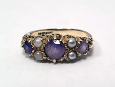 9ct gold, amethyst and seedpearl ring, the three circular mix cut amethysts with seedpearl points,