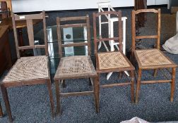 Four cane-seated dining chairs, a white painted towel rack and a 20th century three-tier glass