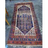 Caucasian style wool rug, the midnight blue field with allover herati and having ivory spandrels,