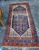 Caucasian style wool rug, the midnight blue field with allover herati and having ivory spandrels,