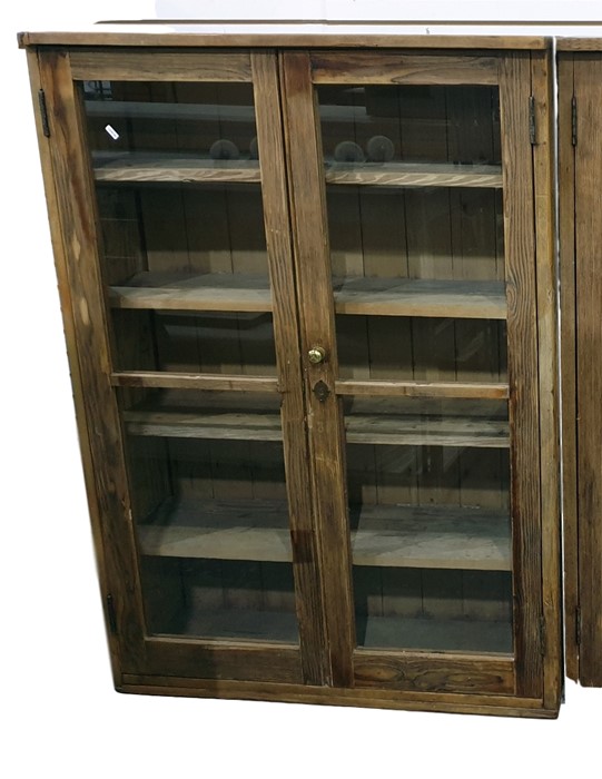 Old pine glazed storage cupboard with pair panelled doors enclosing four shelves, width 92cm
