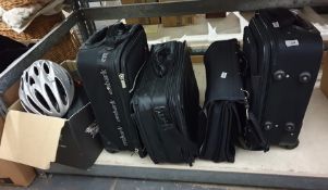 Three various suitcases a Samsonite laptop bag, a cycle helmet and a motorcycle helmet (5)