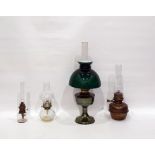 Four assorted oil lamps