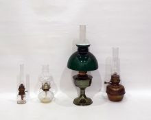 Four assorted oil lamps