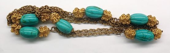 Costume jewellery necklace with large turquoise glass beads, set within gilt metal mounts and