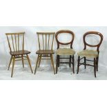 Pair of elm seated stickback dining chairs in the manner of Ercol and a pair of Victorian balloon-