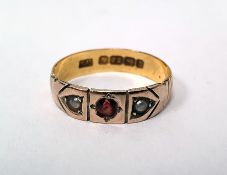 LOT WITHDRAWN 22ct two-colour gold band ring set with a central garnet flanked by two seedpearls,