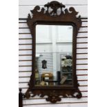 19th century mahogany framed wall mirror, the pediment as an eagle, with fretwork carving to the