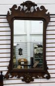 19th century mahogany framed wall mirror, the pediment as an eagle, with fretwork carving to the