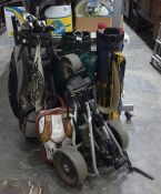 Three various golf bags, golf trolley, golf clubs, golf umbrella, etc