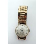 J W Benson gent's gold wristwatch with subsidiary seconds dial, Roman numerals, on metal expanding