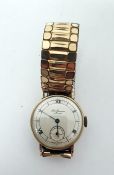 J W Benson gent's gold wristwatch with subsidiary seconds dial, Roman numerals, on metal expanding
