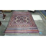 Cream ground Eastern rug decorated in red, blue and brown, 257cm x 190cm