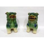 Two pottery model Dogs of Fo, green/blue glazed, 23cm high (2)
