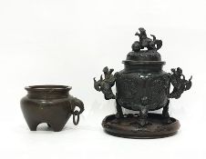 Chinese bronze censer, of circular form, decorated with landscape panels, with pierced cover, the