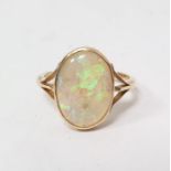 Gold and opal ring, the oval opal in rubover setting, engraved with initials and dated 1917, with