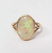 Gold and opal ring, the oval opal in rubover setting, engraved with initials and dated 1917, with