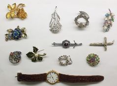 Assorted costume jewellery including brooches, watch, a silver plated bookmark, a silver plated