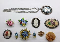 Assorted costume jewellery including brooches, earrings, necklaces, bracelets, a small unused