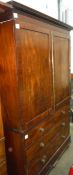 19th century mahogany converted linen press, the moulded pediment above two doors, two short and one