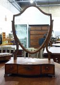 19th century mahogany shield-shaped dressing table mirror on a serpentine fronted and cross-banded