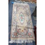 Chinese superwash peach ground rug, 134cm x 78cm