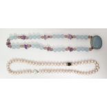 Single row of uniform cultured pearls with a pink tint and a hardstone bead necklace (2)