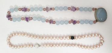 Single row of uniform cultured pearls with a pink tint and a hardstone bead necklace (2)