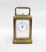 French brass striking carriage clock, with Roman numerals to the dial