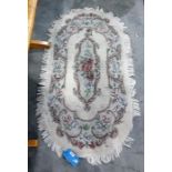 20th century cream ground rug with foliate spray to centre, 150cm x 82cm