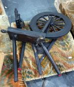 Two bed pans and a spinning wheel