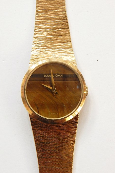 Lady's Bueche-Girod 9ct gold bracelet watch, the circular dial with circular tiger's eye quartz dial