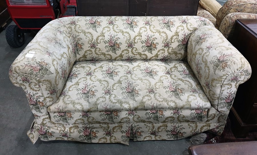 19th century Chesterfield-type drop arm sofa in beige ground foliate patterned upholstery, raised
