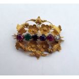 19th century gold-coloured flowerhead-pattern ‘Regard’ brooch set six variously coloured stones in a