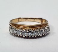 18ct gold band ring set with nine brilliant cut diamonds, finger size T