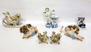 Quantity of Continental decorative porcelain to include wall sconces with cherubs, large vase in the