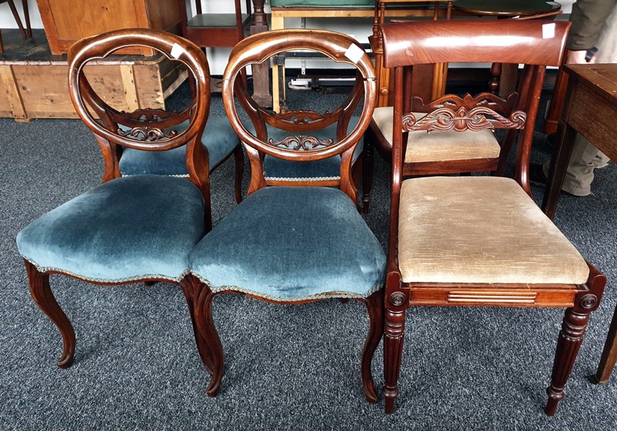 Four 19th century mahogany balloon-back dining chairs with serpentine fronted seats to cabriole legs