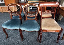 Four 19th century mahogany balloon-back dining chairs with serpentine fronted seats to cabriole legs